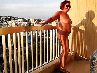 Old Whore Shows Pussy And Ass On The Balcony