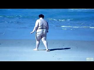 Fat Slut Walking On Beach